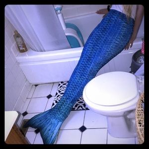 Blue mermaid tail and monofin for swimming